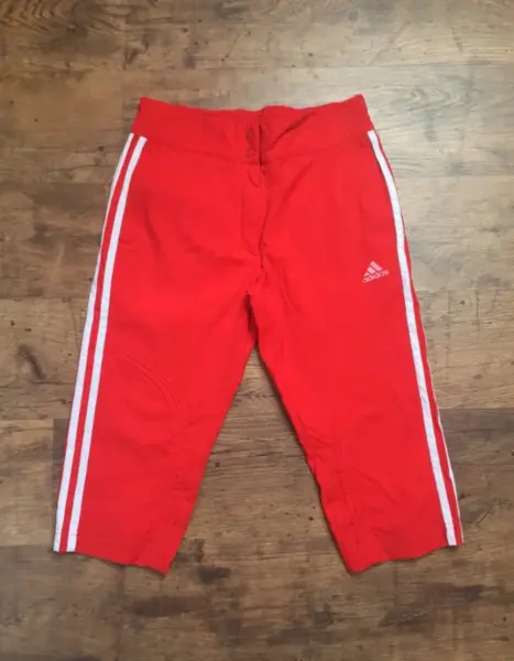 Červené dívčí  3/4 sportovní kalhoty Adidas vel 152